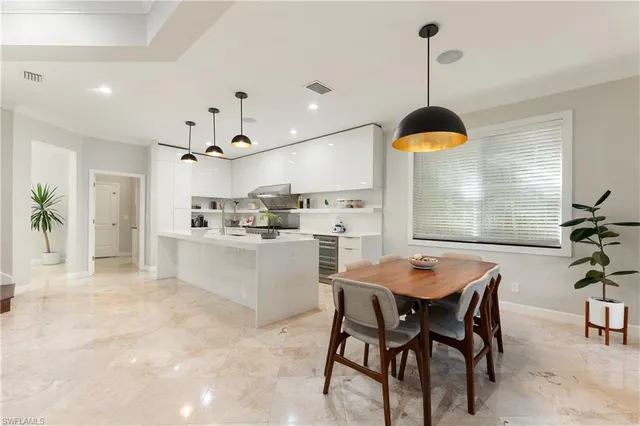 a kitchen with a table and chairs in it