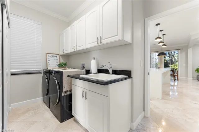 a kitchen with a sink a stove and cabinets