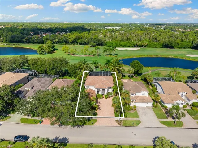 an aerial view of residential houses with outdoor space and street view