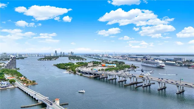a view of a terrace with lawn chairs
