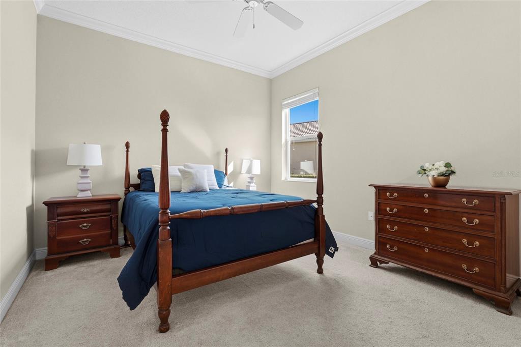 357 Marsh Creek Road Venice, FL 34292 - Photo 32 of 70 a bedroom with a bed and a dresser