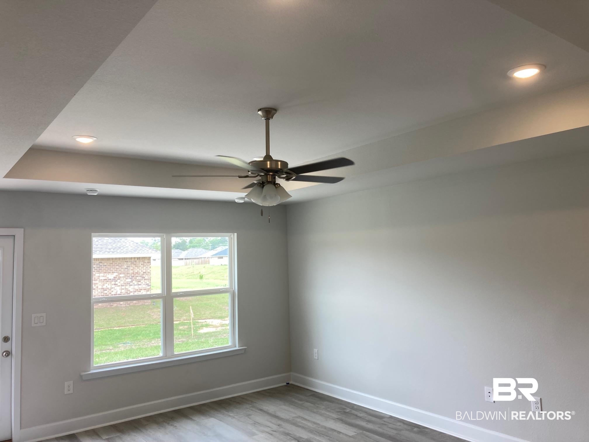 705 Mayflower Drive Foley, AL 36535 - Photo 8 of 19 Unfurnished room with baseboards, wood finished floors, ceiling fan, and recessed lighting