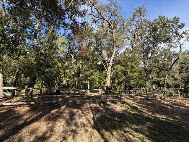 a view of outdoor space with deck and tree