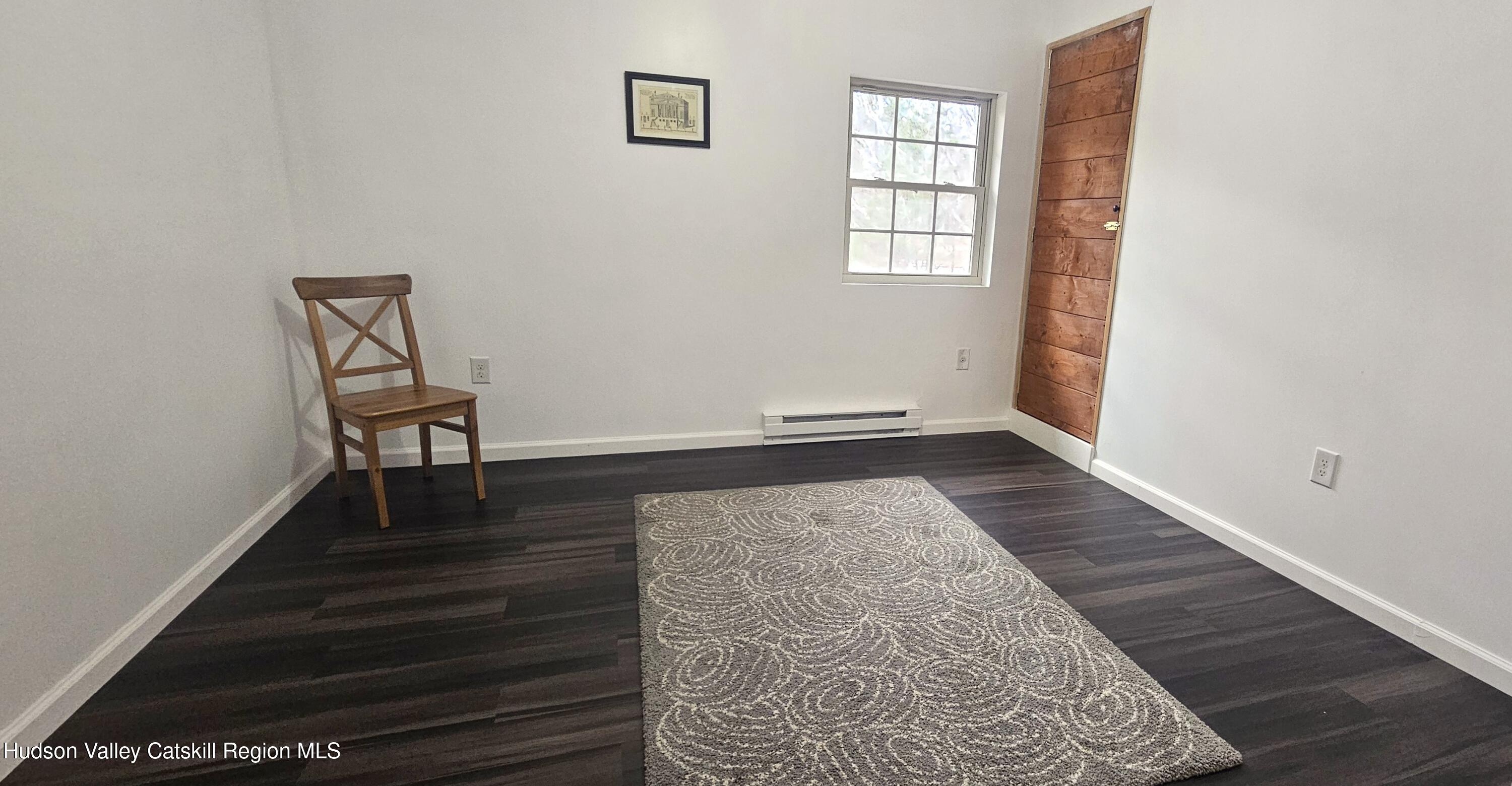374 North Ridge Road Hannacroix, NY 12087 - Photo 13 of 24 an empty room with wooden floor and windows