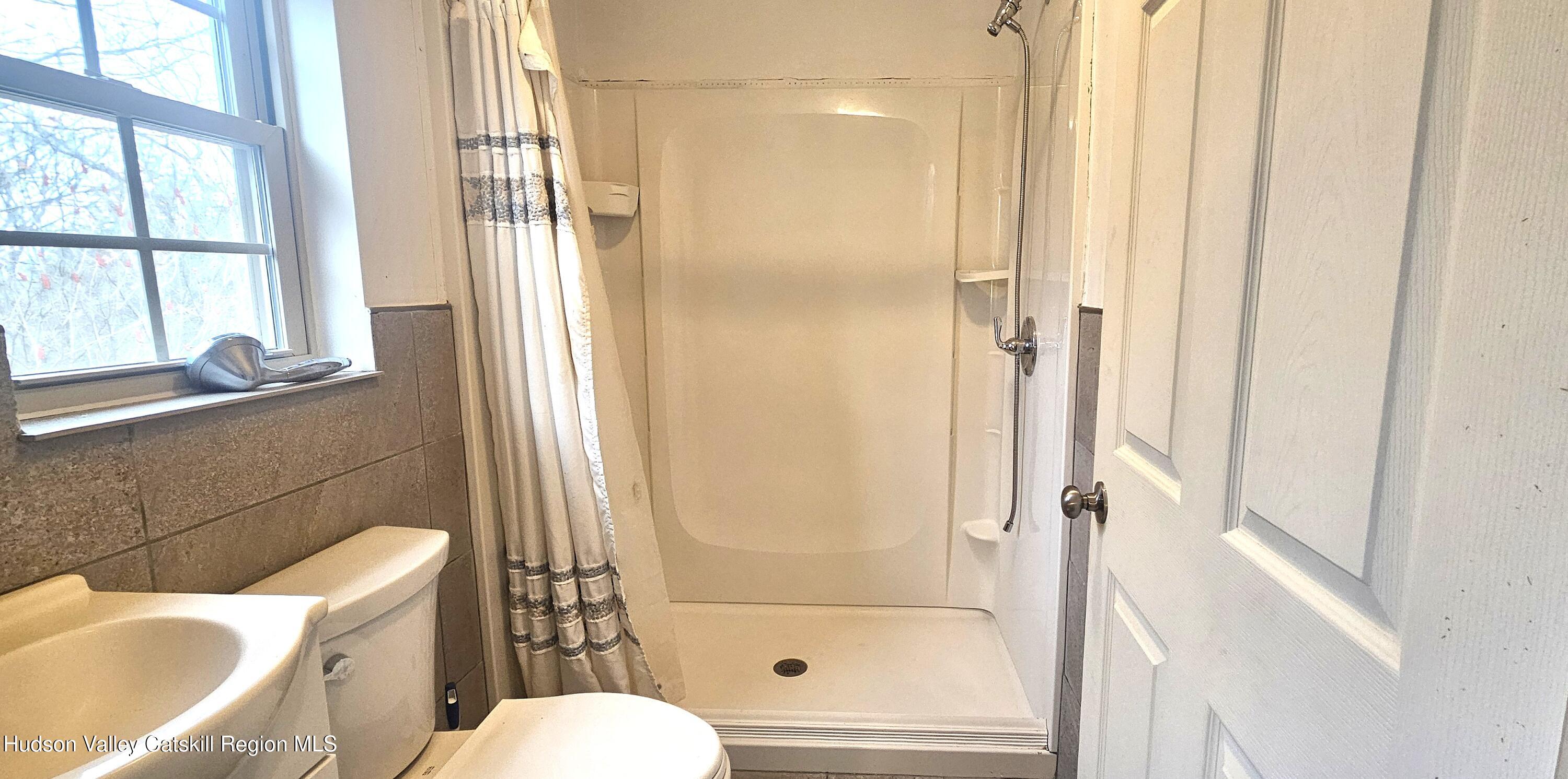 374 North Ridge Road Hannacroix, NY 12087 - Photo 15 of 24 a bathroom with a sink toilet and shower