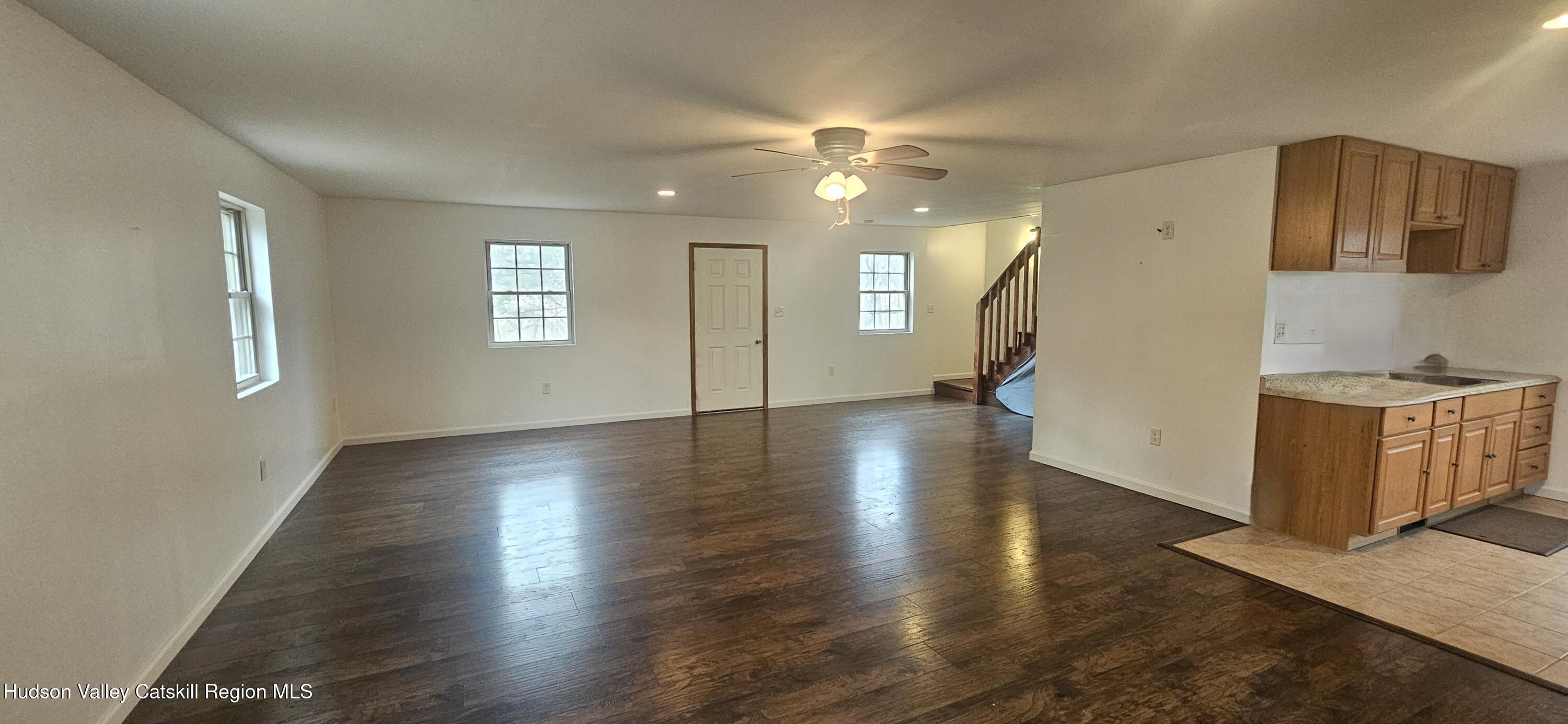 374 North Ridge Road Hannacroix, NY 12087 - Photo 2 of 24 an empty room with wooden floor and windows