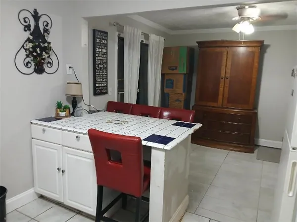 a kitchen with a sink and a refrigerator