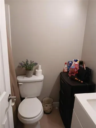 a bathroom with a toilet and a sink