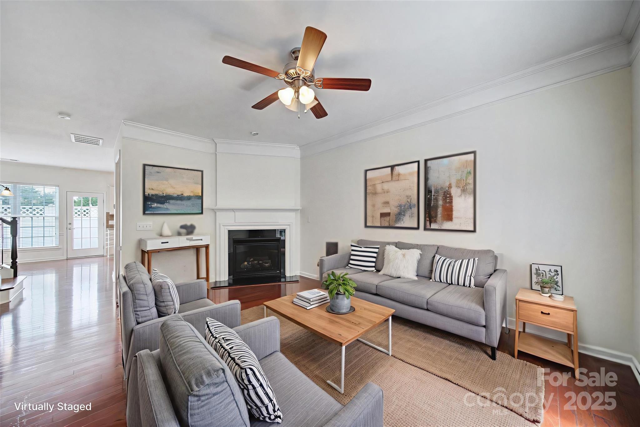 625 6th Baxter Crossing Fort Mill, SC 29708 - Photo 12 of 48 a living room with furniture a fireplace and a flat screen tv