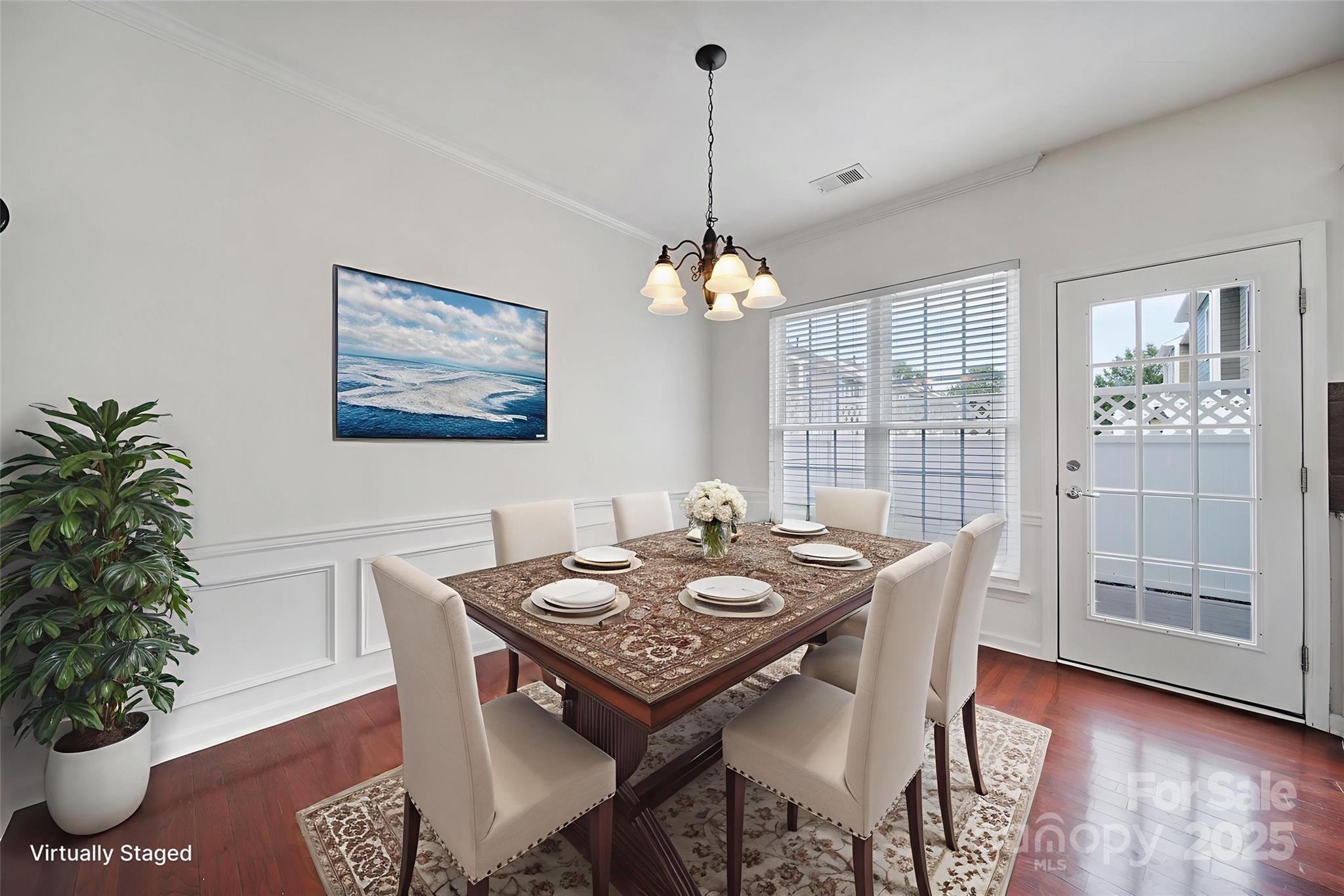 625 6th Baxter Crossing Fort Mill, SC 29708 - Photo 17 of 48 a view of a dining room with furniture window and wooden floor