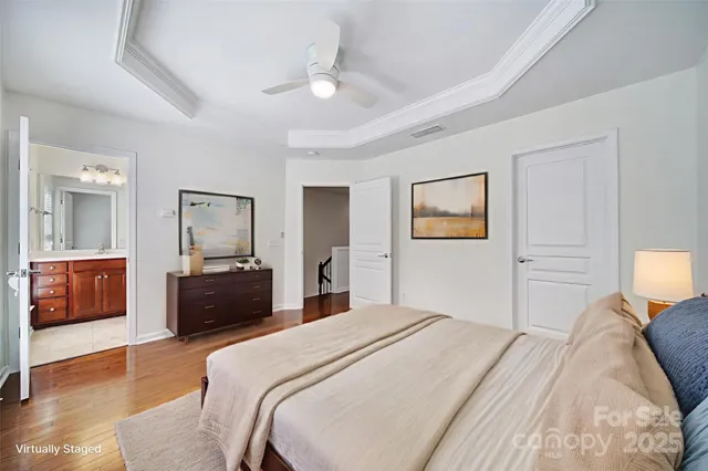 a bedroom with a bed and a couch