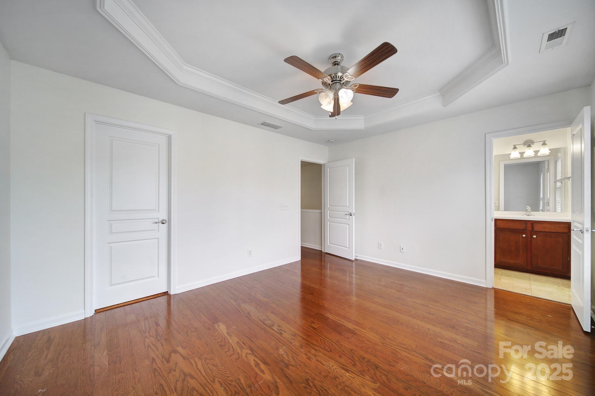 625 6th Baxter Crossing Fort Mill, SC 29708 - Photo 26 of 48 an empty room with wooden floor and windows