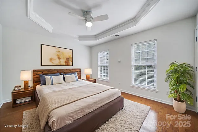 a bed room with a bed and a potted plant