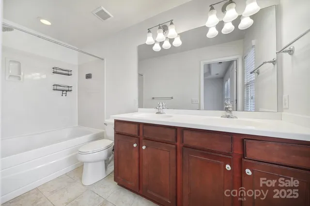 a bathroom with a sink a toilet and a bathtub