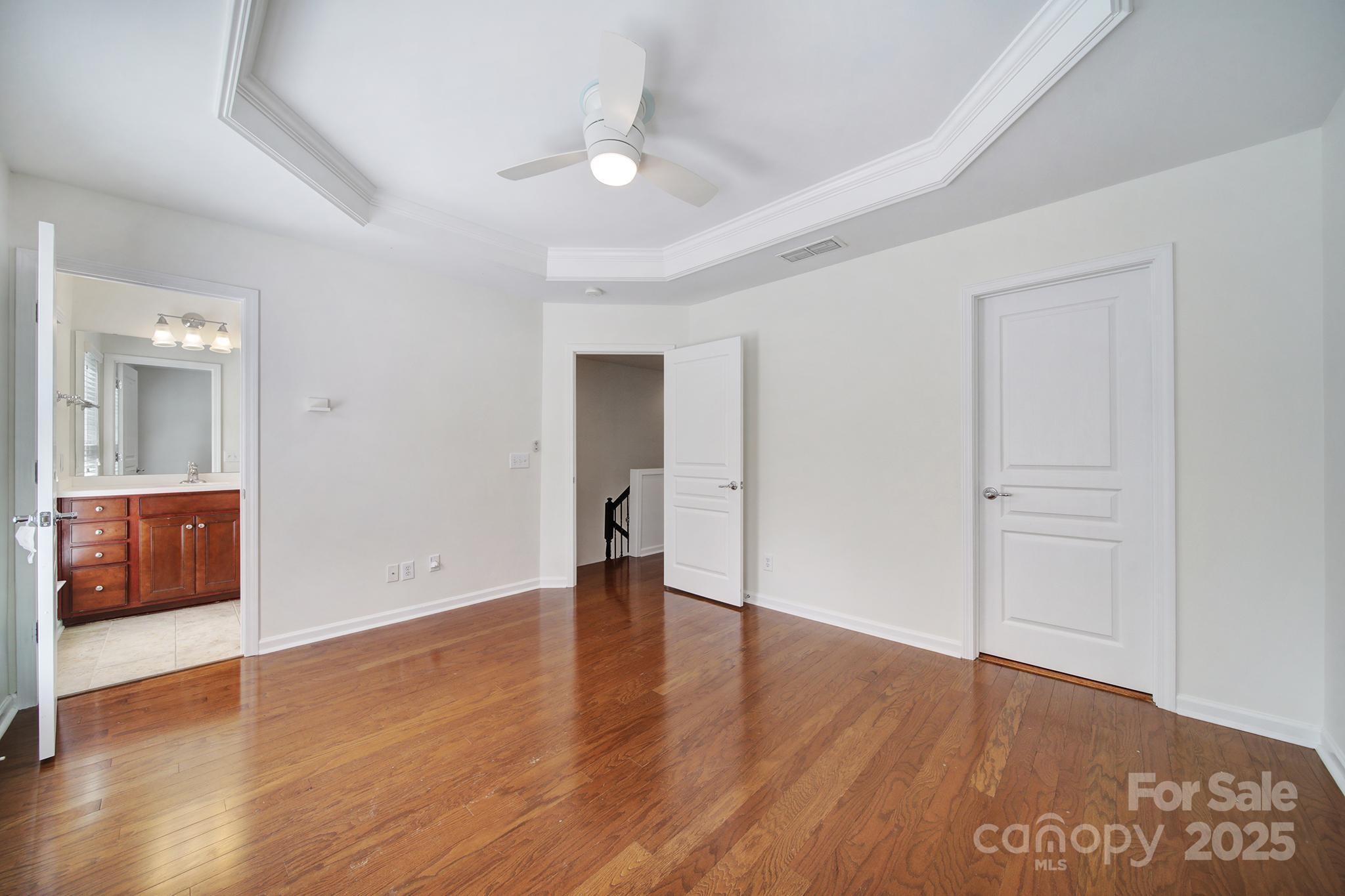 625 6th Baxter Crossing Fort Mill, SC 29708 - Photo 30 of 48 an empty room with wooden floor and windows
