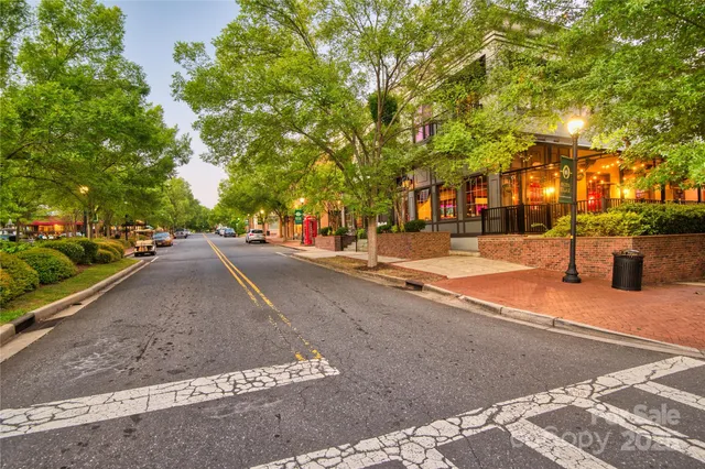 a view of street with parked cars