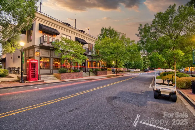 a view of a house with swimming pool and sitting area