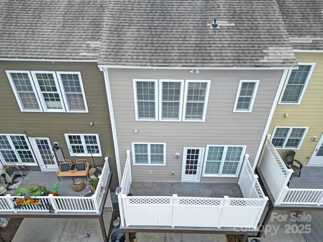 a front view of a house with outdoor seating