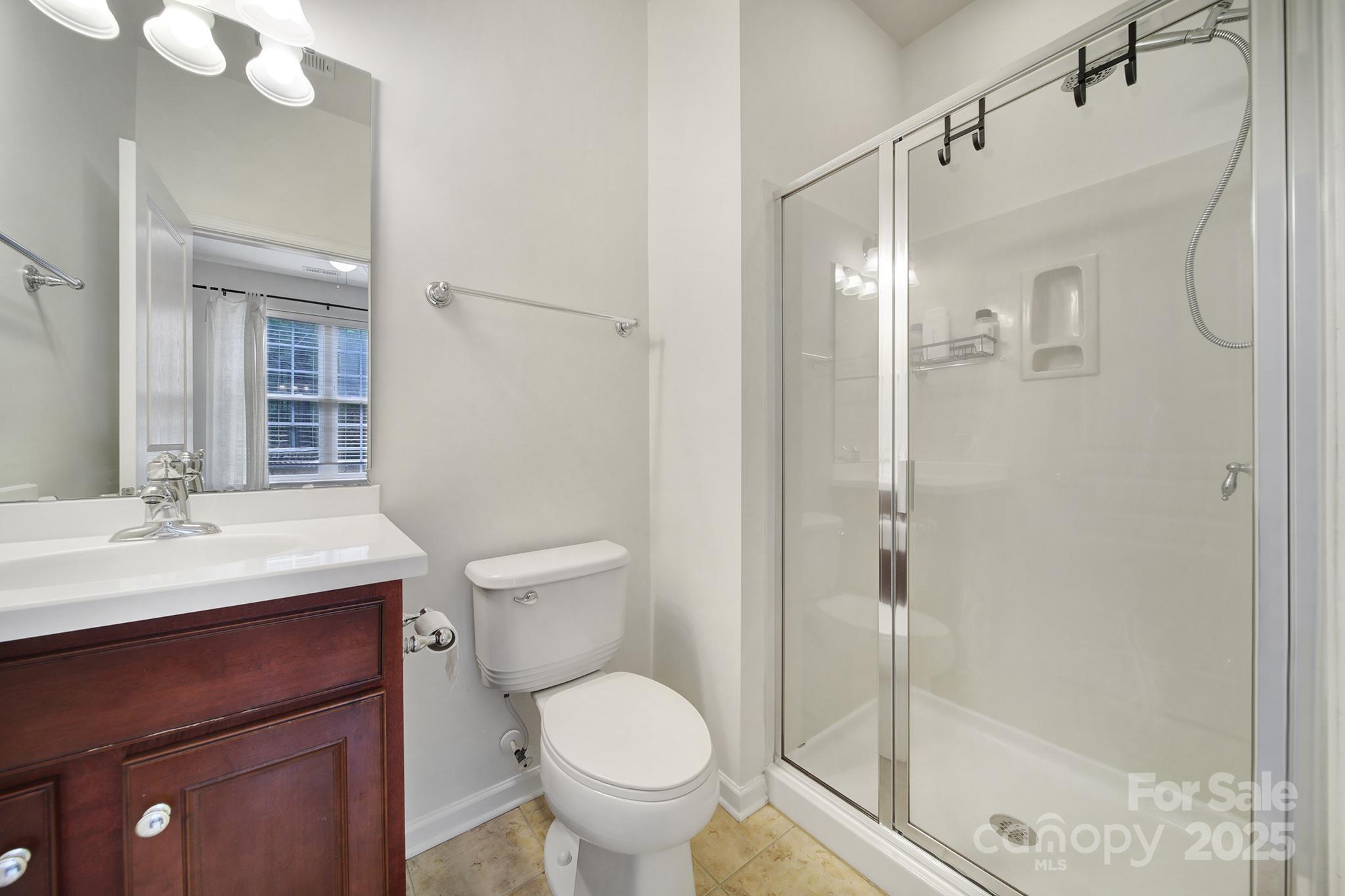 625 6th Baxter Crossing Fort Mill, SC 29708 - Photo 9 of 48 a bathroom with a sink toilet and shower