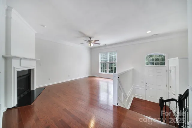 a view of livingroom with hardwood floor and a ceiling fan