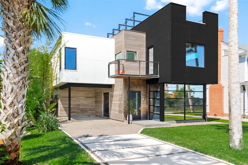 a view of a house with a yard and plants