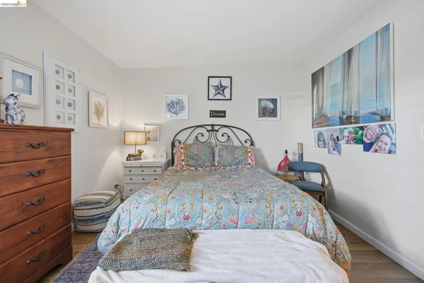 a bedroom with a bed and a dresser