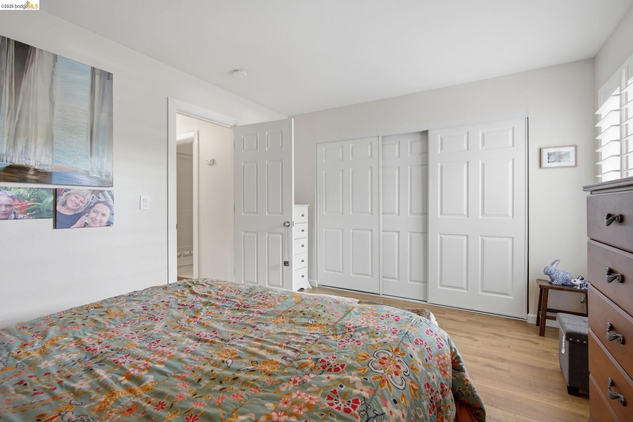 4081 Clayton Road, Unit 118 Concord, CA 94521 - Photo 15 of 30 Bedroom featuring light wood-type flooring and a closet