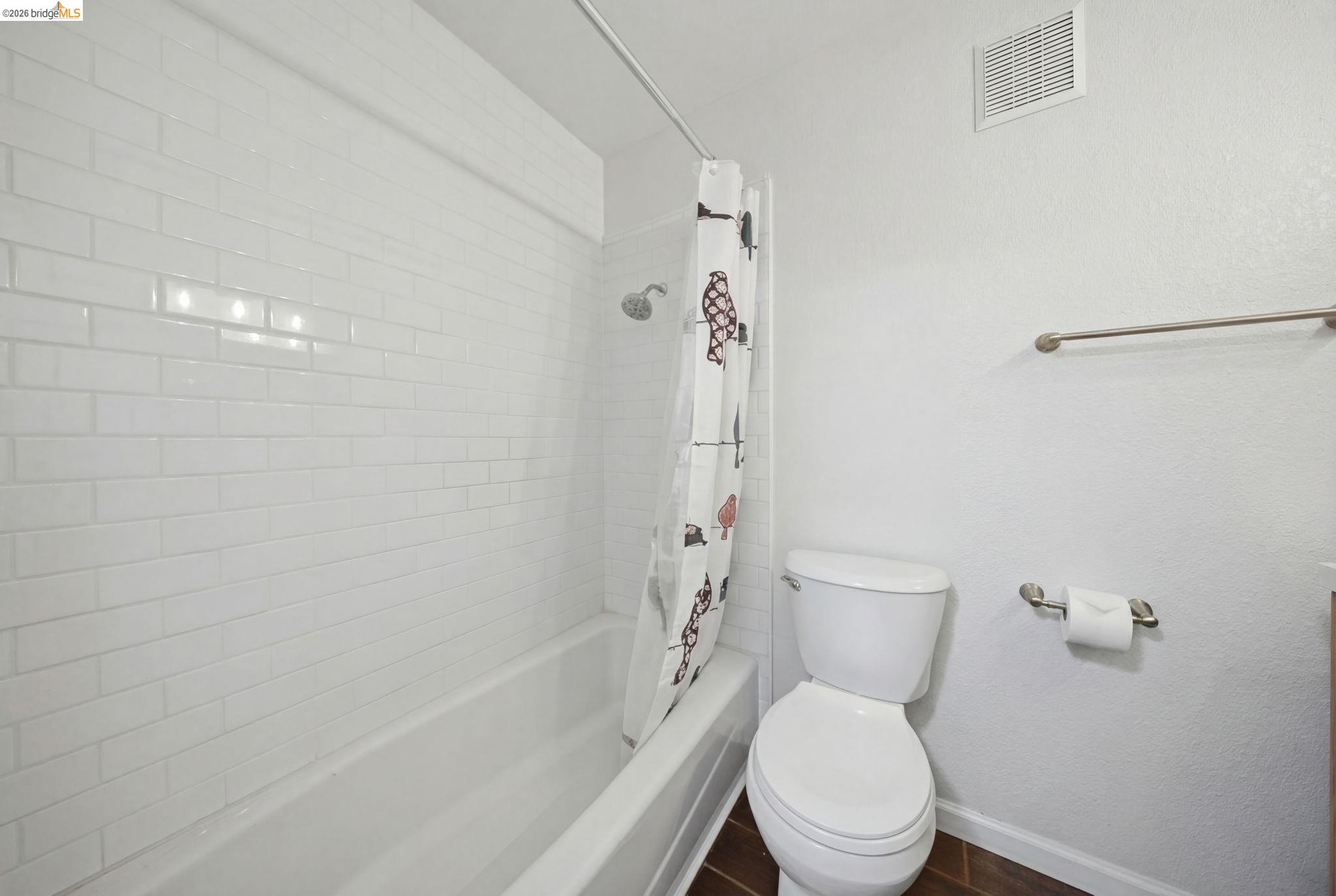4081 Clayton Road, Unit 118 Concord, CA 94521 - Photo 18 of 30 Full bathroom with baseboards and shower / tub combo with curtain