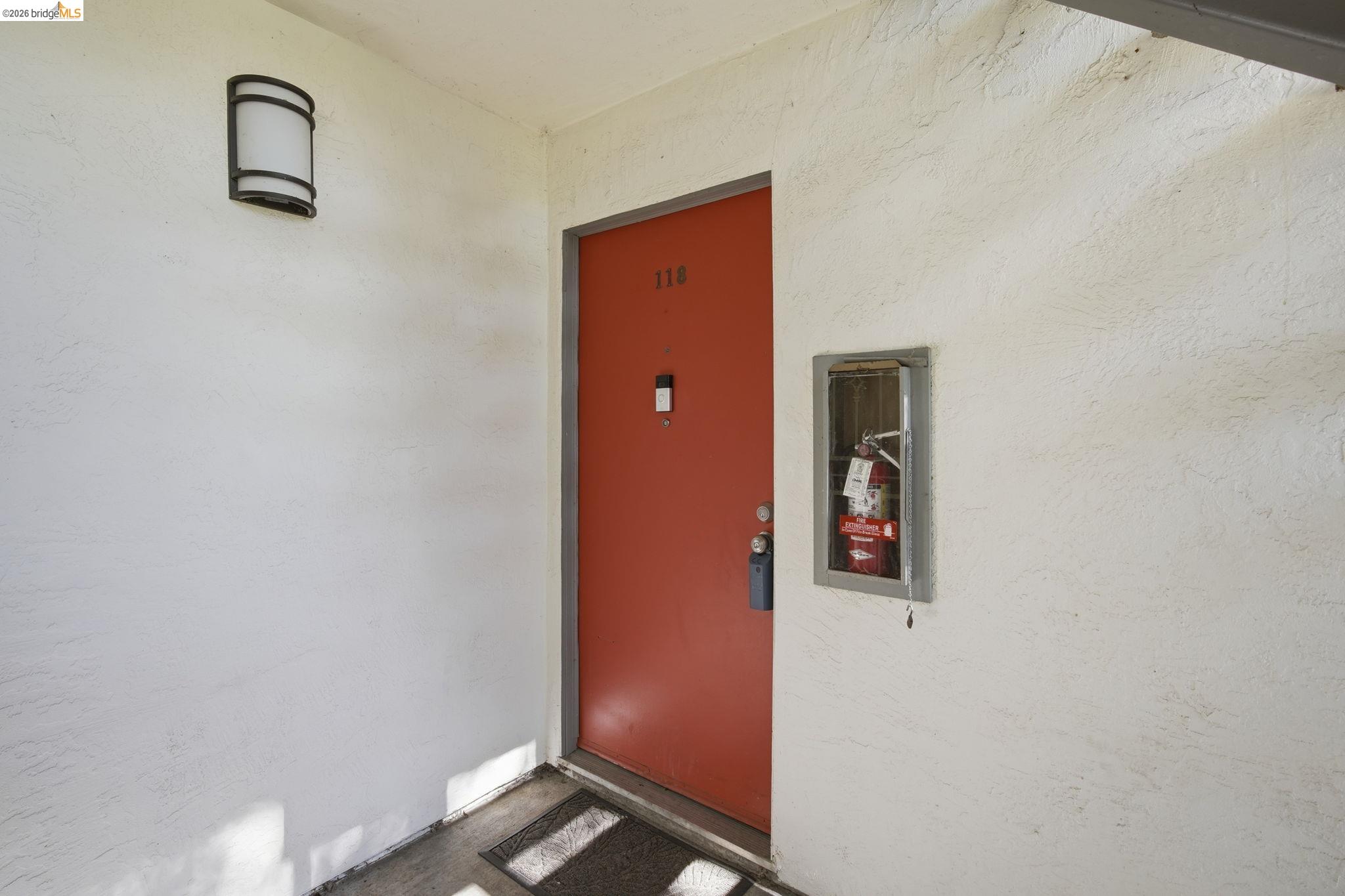 4081 Clayton Road, Unit 118 Concord, CA 94521 - Photo 21 of 30 View of exterior entry with stucco siding