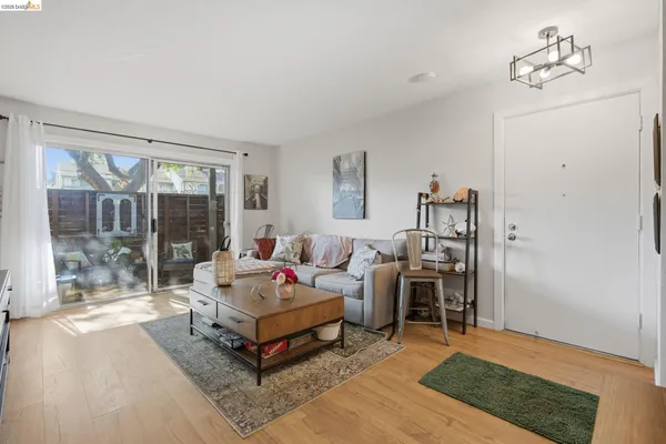 a living room with furniture rug and window