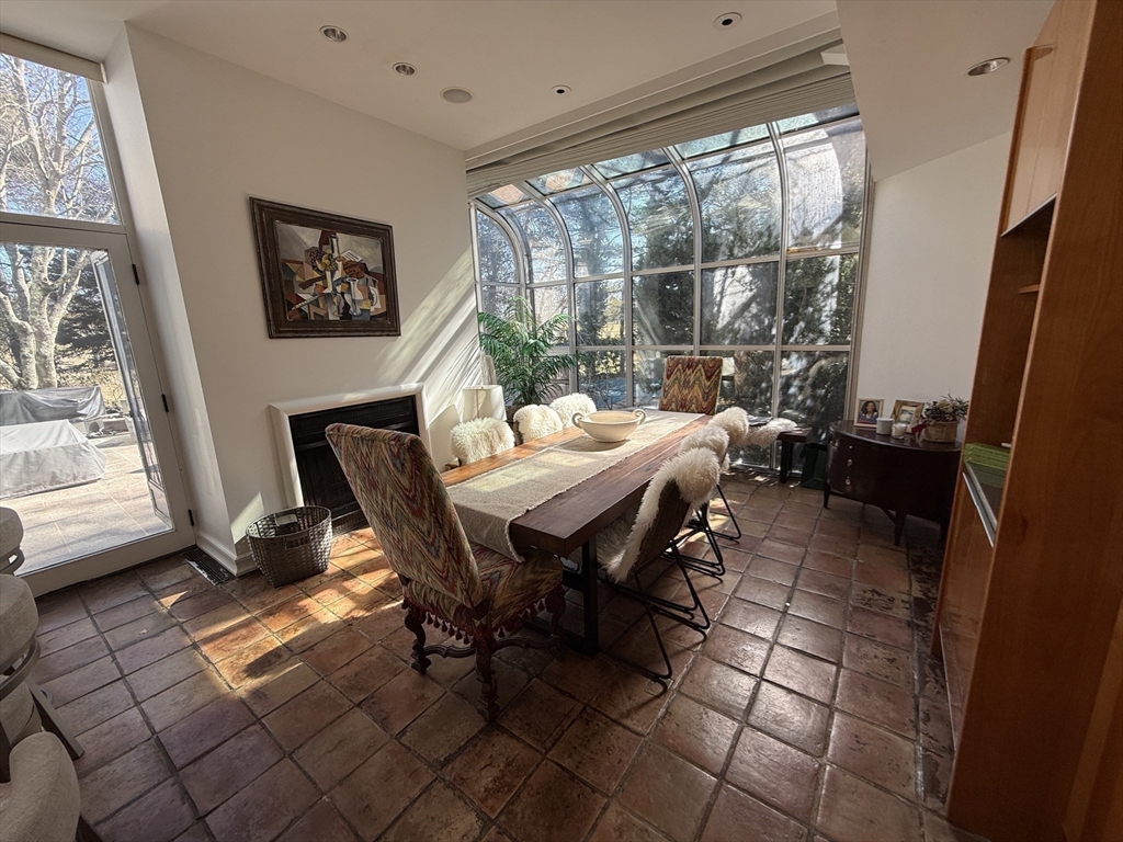 132 Yarmouth Road Brookline, MA 02467 - Photo 11 of 22 a dining room with furniture and a floor to ceiling window