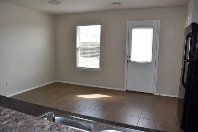 an empty room with windows