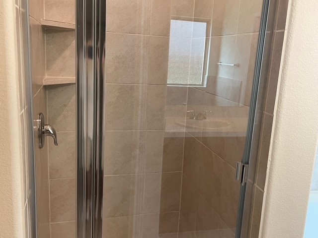 10125 Gertrudis Loop Austin, TX 78747 - Photo 11 of 27 Bathroom with a stall shower