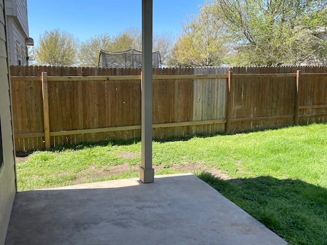 10125 Gertrudis Loop Austin, TX 78747 - Photo 25 of 27 Fenced backyard featuring a patio area