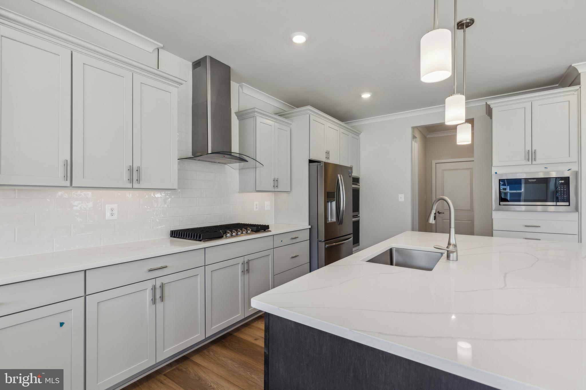113 Stilly Way Annapolis, MD 21403 - Photo 1 of 13 a kitchen with a sink a refrigerator and cabinets