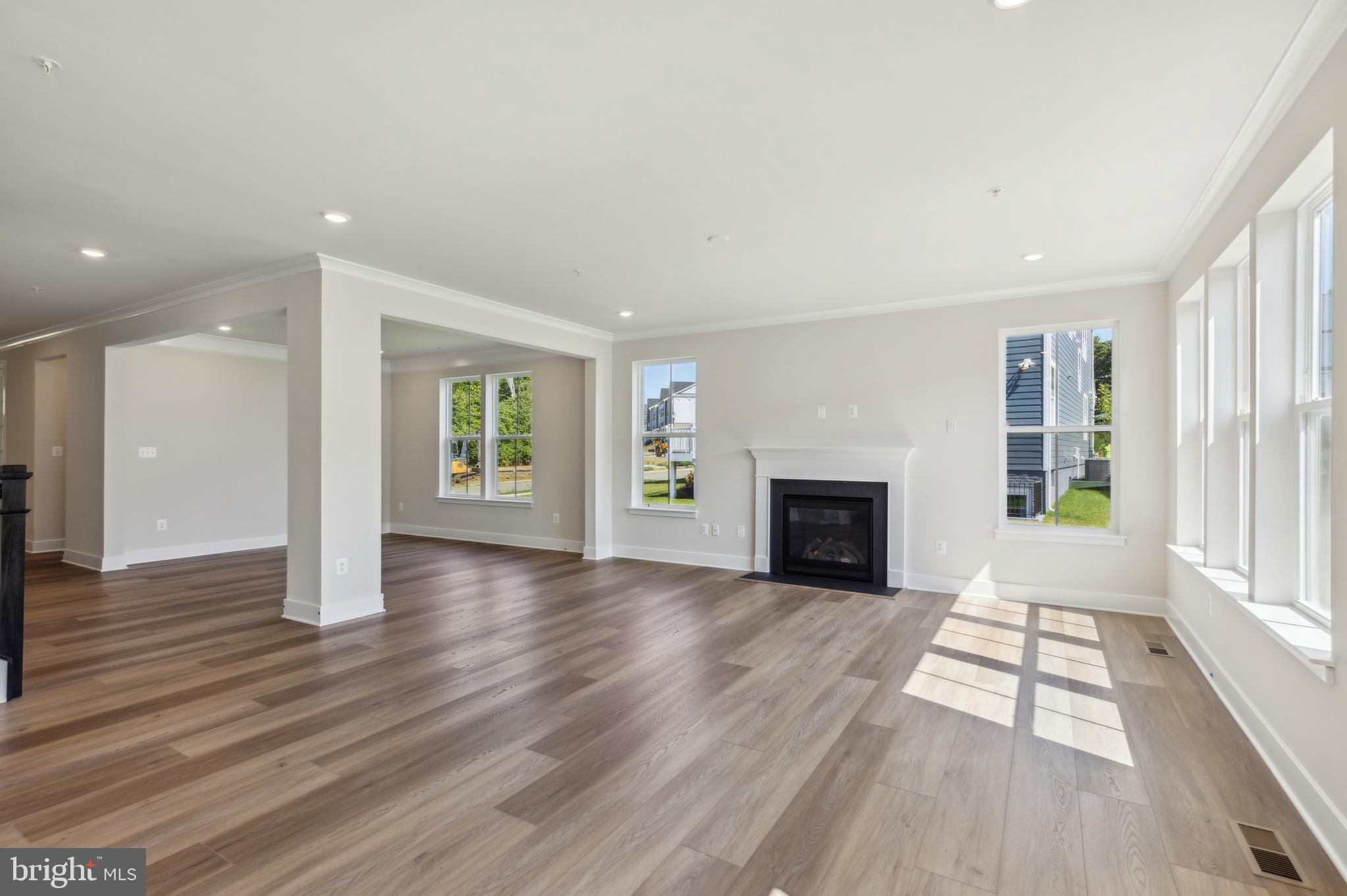 113 Stilly Way Annapolis, MD 21403 - Photo 11 of 13 wooden floor fireplace and windows in an empty room