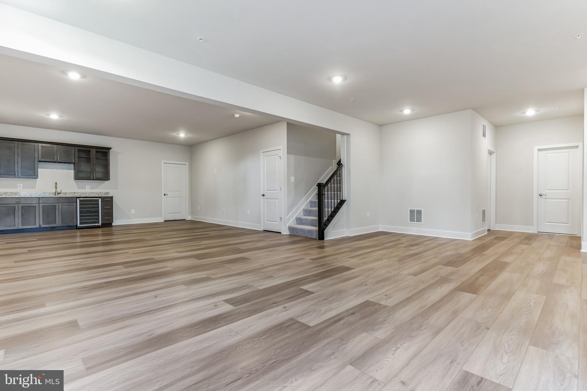 113 Stilly Way Annapolis, MD 21403 - Photo 12 of 13 a view of empty room with wooden floor and a fireplace