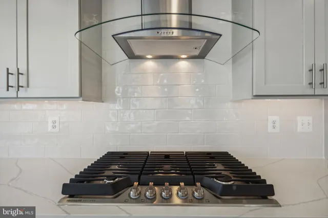 a close view of a stove a microwave and cabinets