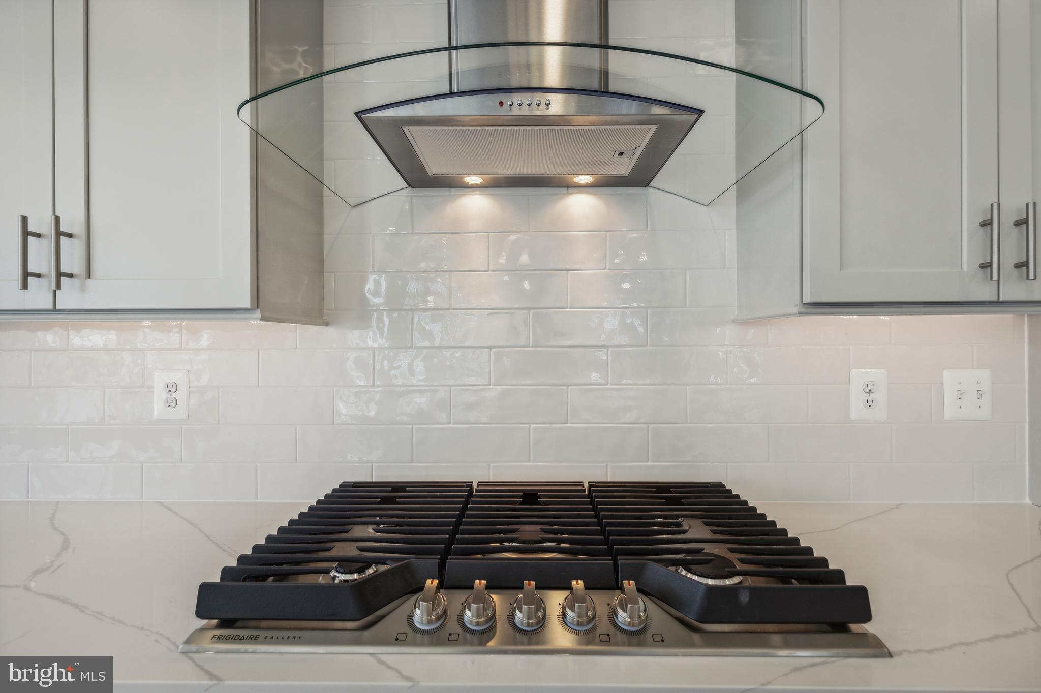 113 Stilly Way Annapolis, MD 21403 - Photo 5 of 13 a close view of a stove a microwave and cabinets