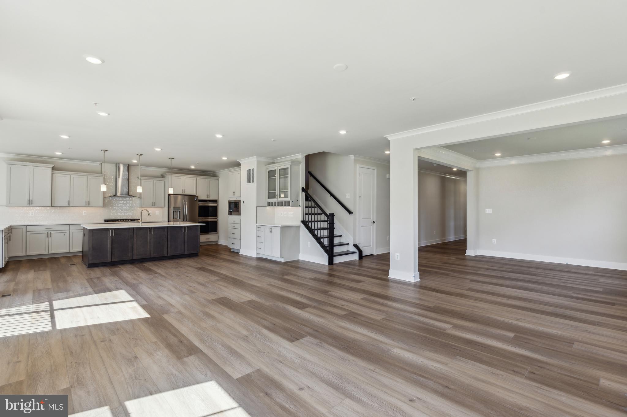 113 Stilly Way Annapolis, MD 21403 - Photo 10 of 13 a view of a living room with kitchen furniture and wooden floor