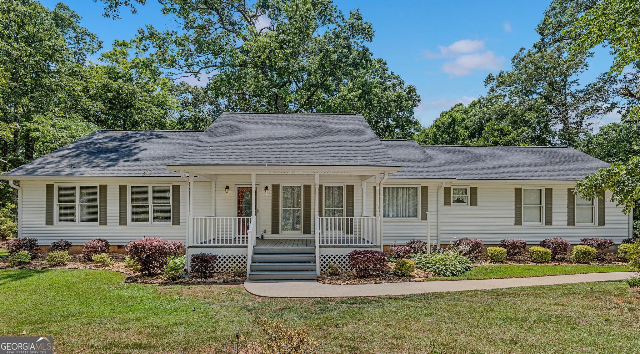 front view of a house with a yard