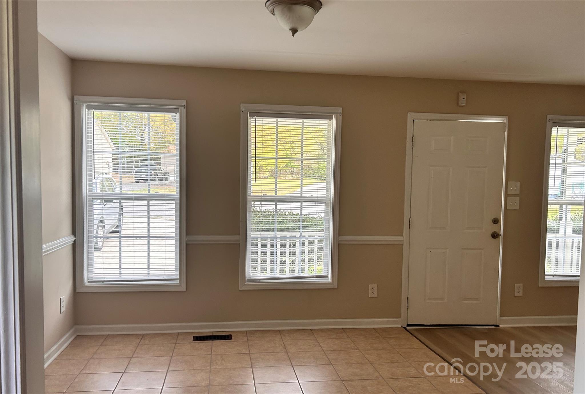 910 Aggie Street Kannapolis, NC 28083 - Photo 4 of 10 an empty room with windows