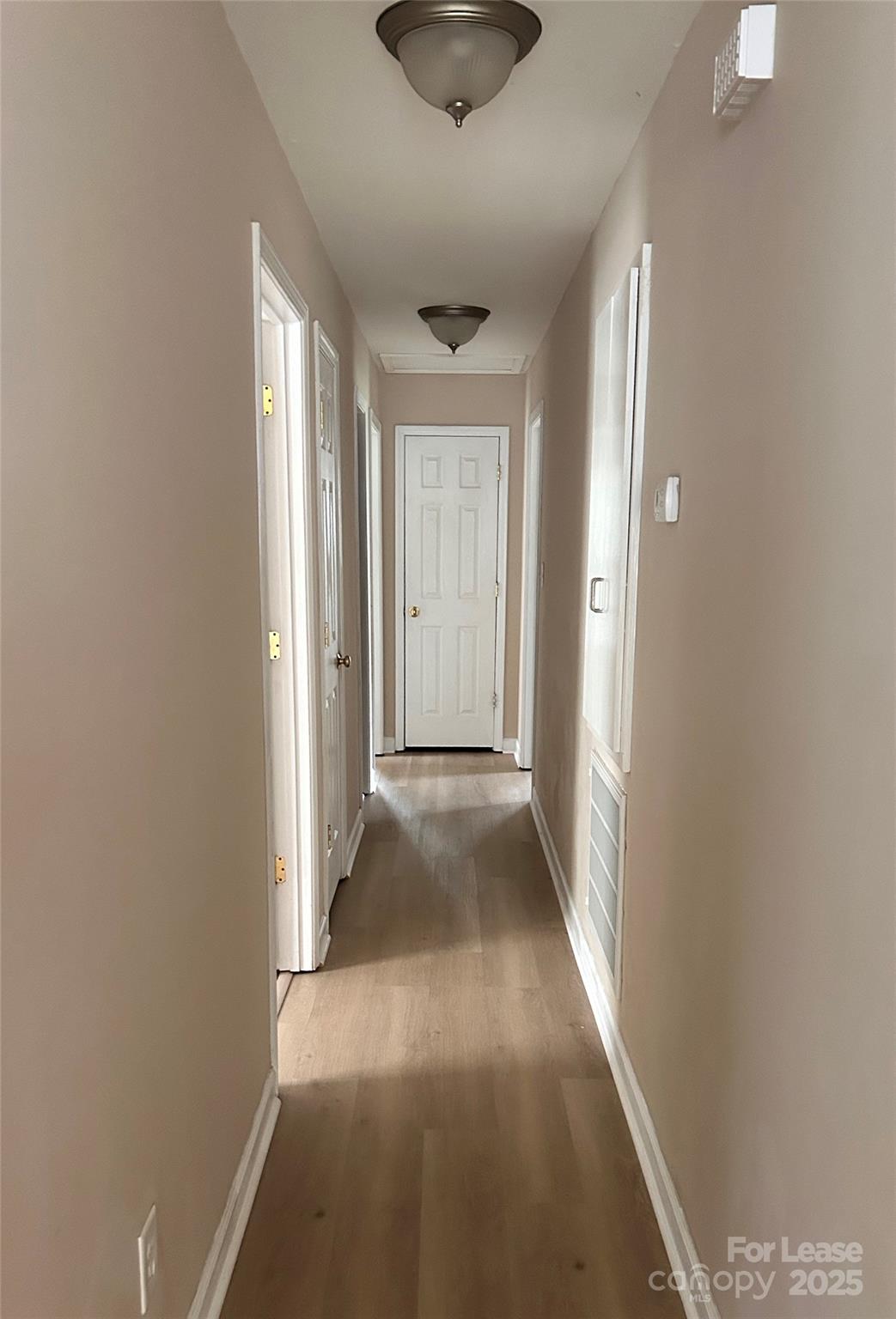 910 Aggie Street Kannapolis, NC 28083 - Photo 6 of 10 a view of a hallway with a chandelier