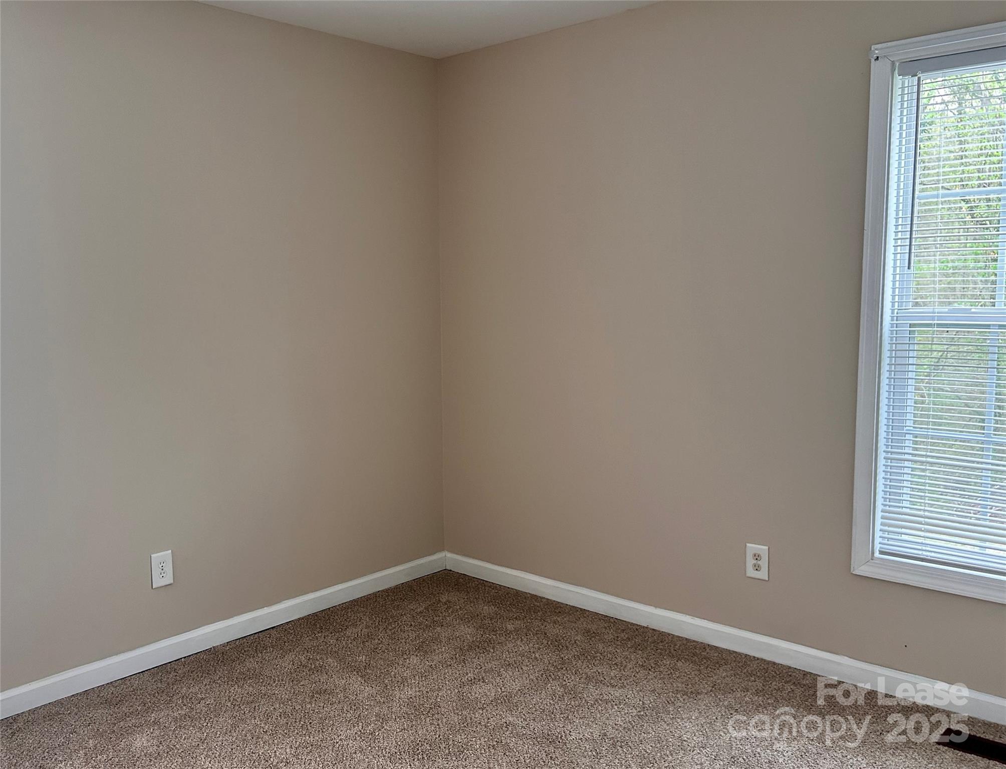 910 Aggie Street Kannapolis, NC 28083 - Photo 10 of 10 an empty room with a window