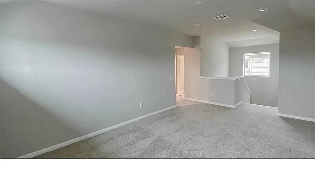 10612 Gonzales Ranger Pass Austin, TX 78754 - Photo 15 of 19 Plush carpeting and recessed lighting define this versatile second-floor loft space.