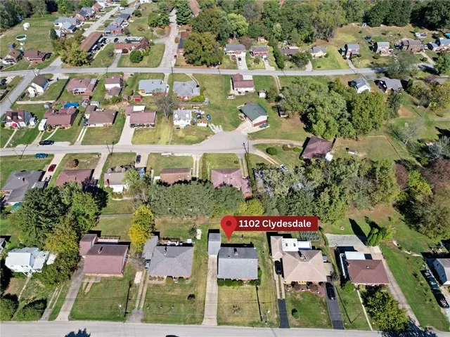 an aerial view of residential building and parking space