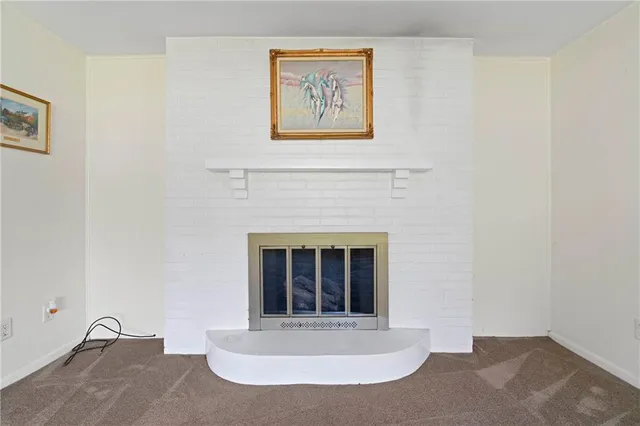 a view of a fireplace with window