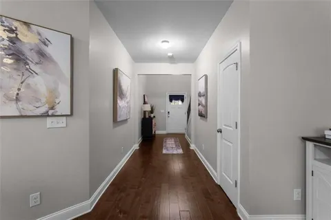 a bedroom with two beds and a flat screen tv