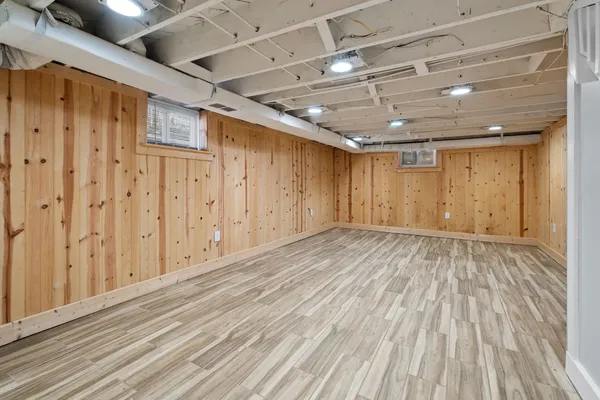 a view of hallway with wooden floor