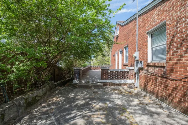 a view of outdoor space with yard and trees